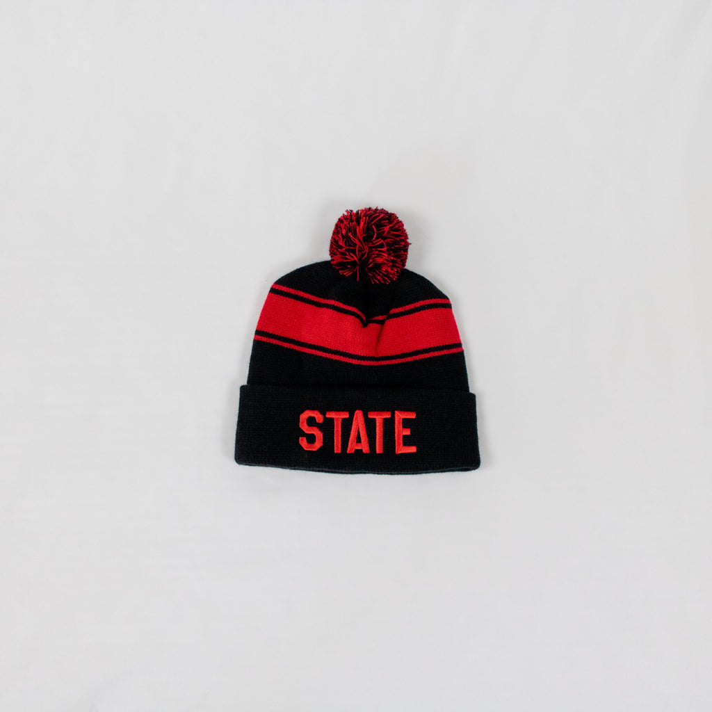 black and red striped beanie with a two-tone pom on top STATE embroidered in red on front fold