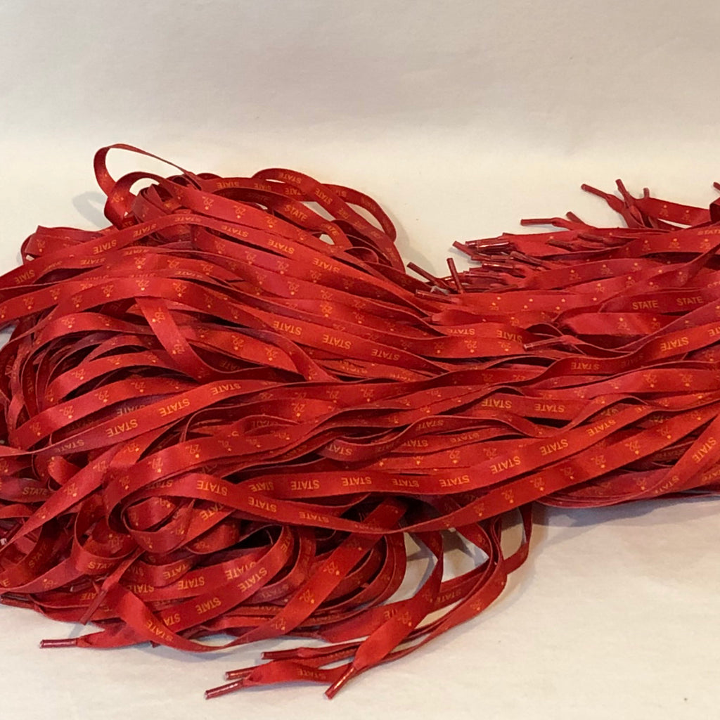 a pile of red shoelaces with state in gold on one side and the 29th state logo on the other side