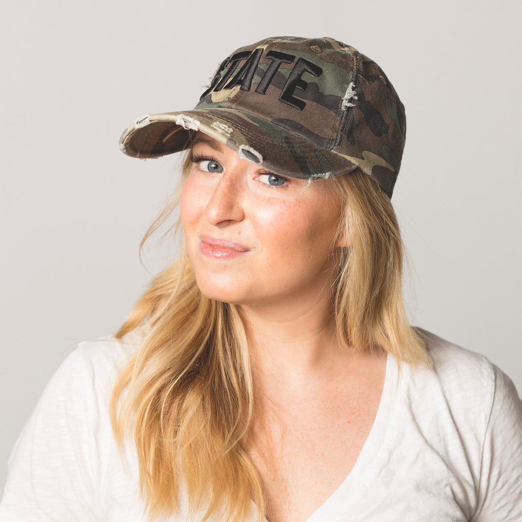 front view on model STATE Distressed Baseball Hat camo